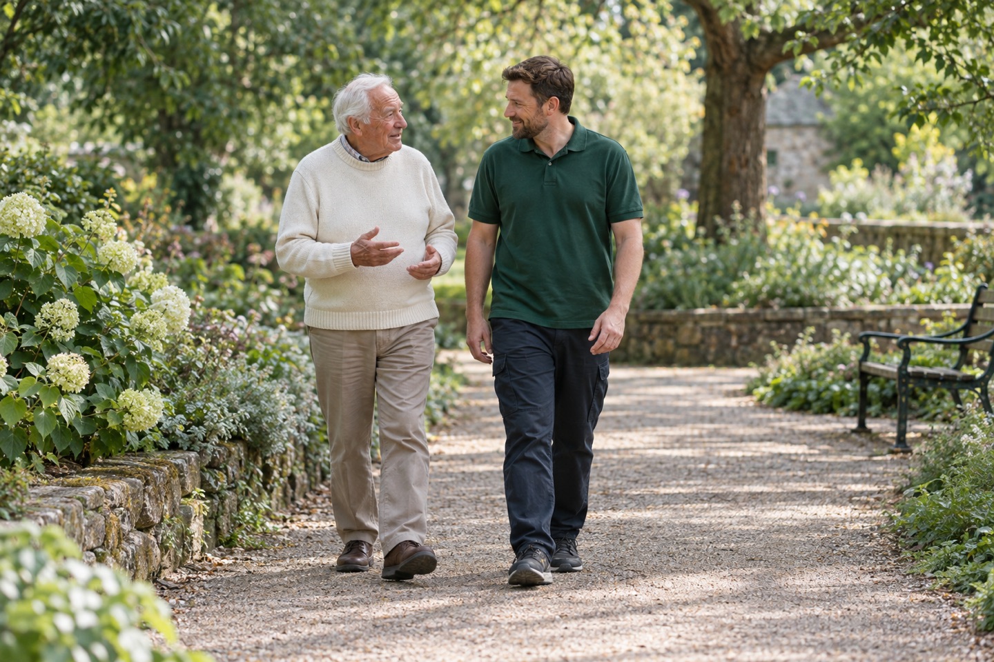 Illustrative older adult and support worker walking through a garden
